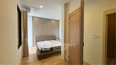 Modern bedroom with stylish decor and natural lighting