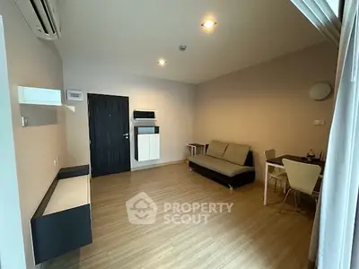 Spacious modern living room with minimalist decor and wooden flooring