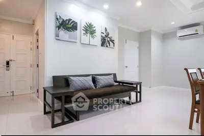 Modern living room with sleek furniture and stylish decor in a bright apartment.