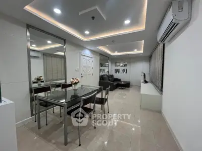 Modern living room with sleek dining area and stylish decor