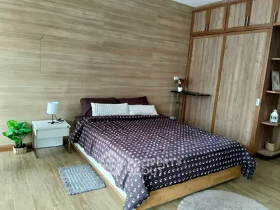 Cozy bedroom with wooden accents and modern decor