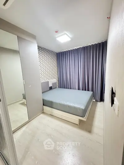 Modern bedroom with stylish decor and ample storage space