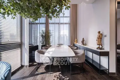 Elegant dining area with modern decor and natural light