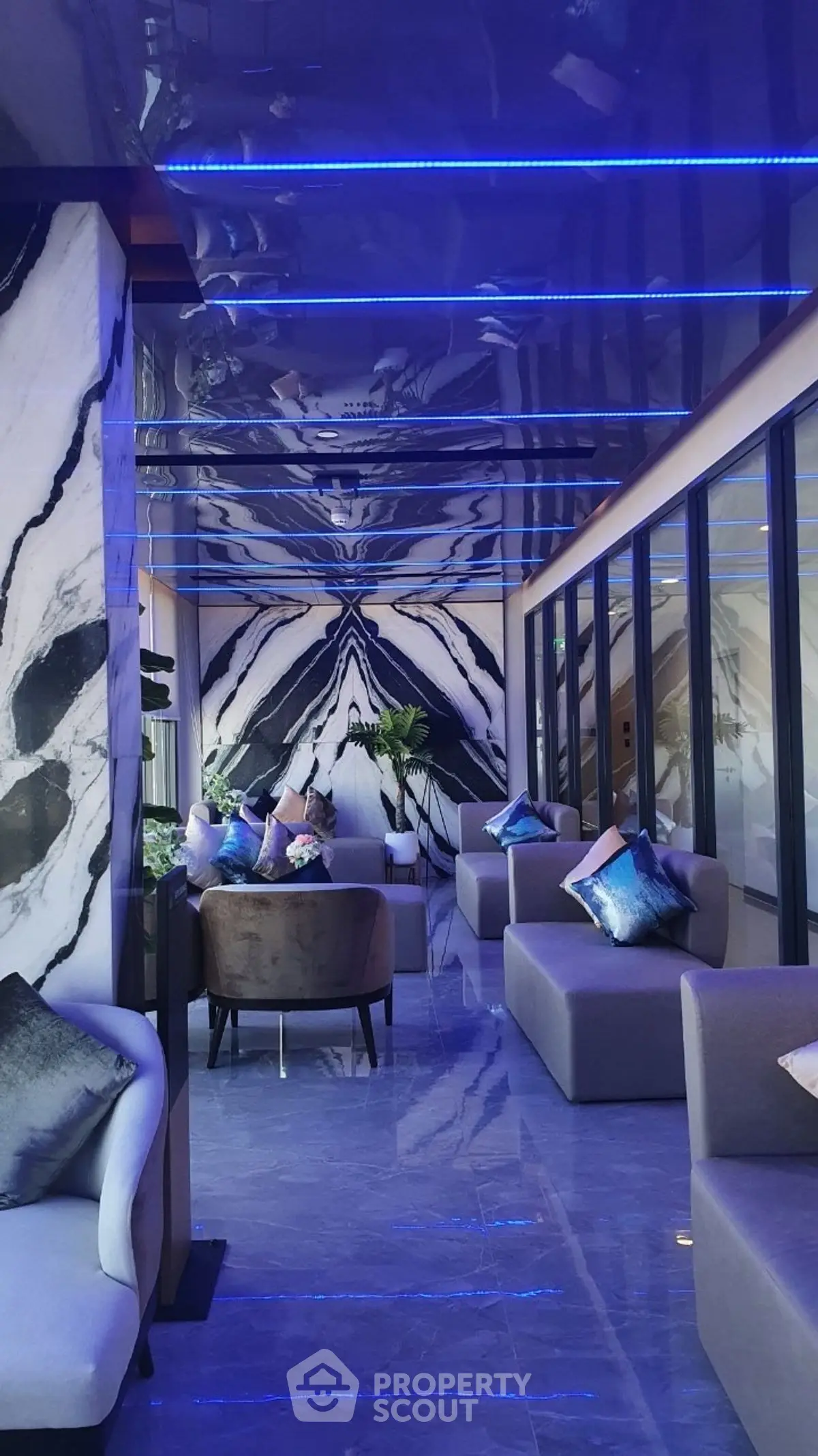 Luxurious modern lounge with marble accents and ambient lighting