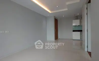 Modern minimalist apartment interior with sleek kitchen and recessed lighting