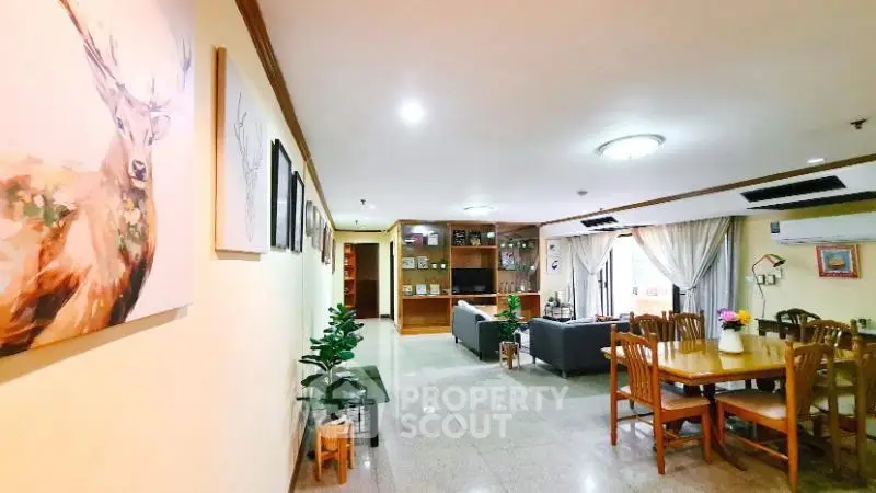 Spacious living and dining area with modern decor and ample natural light.