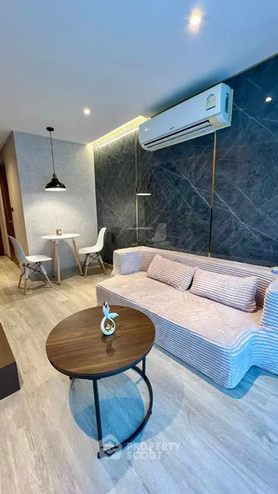 Modern living room with stylish furniture and air conditioning