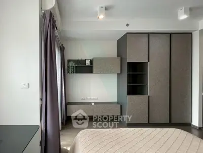 Modern bedroom with stylish wardrobe and elegant decor