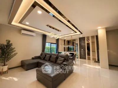 Luxurious modern living room with stylish lighting and elegant decor, perfect for relaxation and entertainment.
