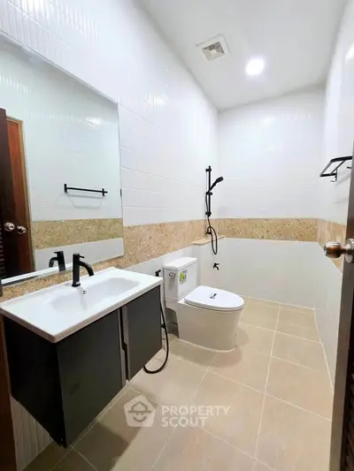 Modern bathroom with sleek fixtures and stylish tile design