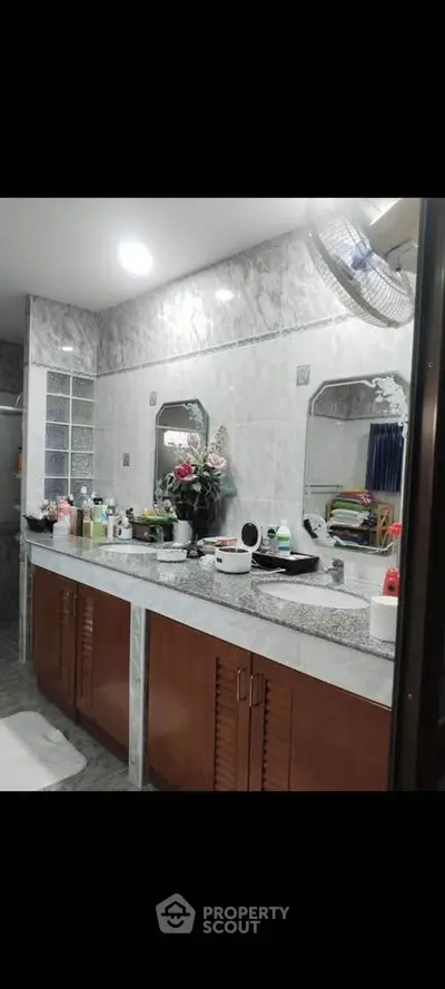 Spacious bathroom with dual sinks and modern decor