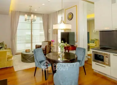 Elegant living room with modern decor, cozy seating, and stylish dining area in open layout.