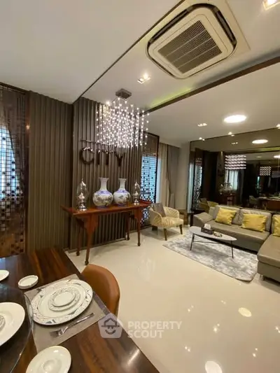 Luxurious living room with elegant decor and modern lighting in a high-end apartment.