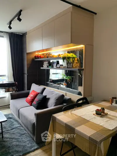 Cozy living room with modern decor and dining area, perfect for urban living.