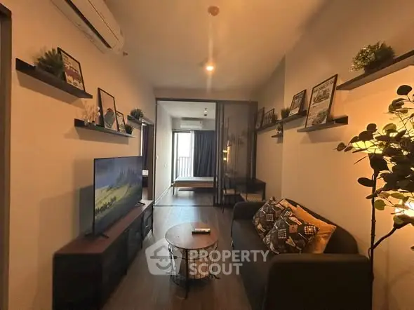 Cozy living room with modern decor and wall-mounted TV, perfect for relaxation.