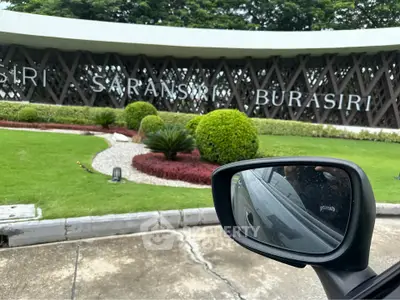 Elegant entrance of Burasiri Saransiri with lush landscaping and modern design