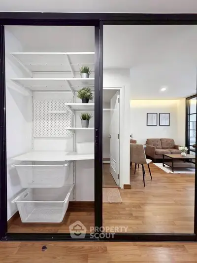 Modern apartment with stylish living room and organized storage space