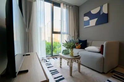 Modern living room with large window and stylish decor