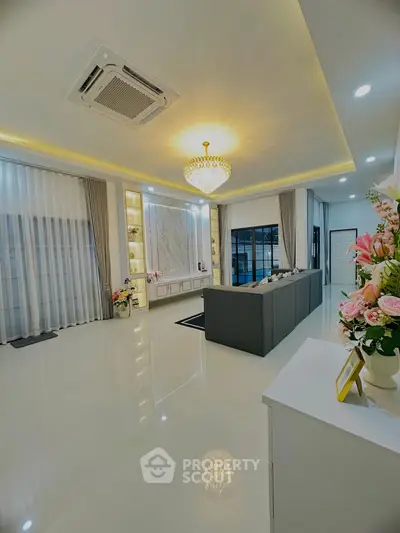 Luxurious living room with elegant chandelier and modern decor