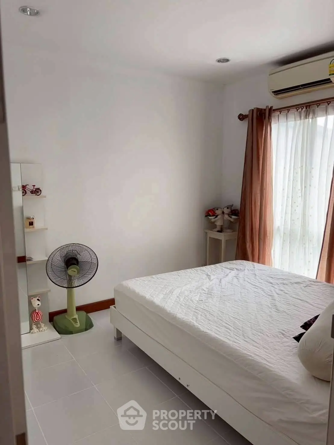 Cozy bedroom with natural light and minimalist decor