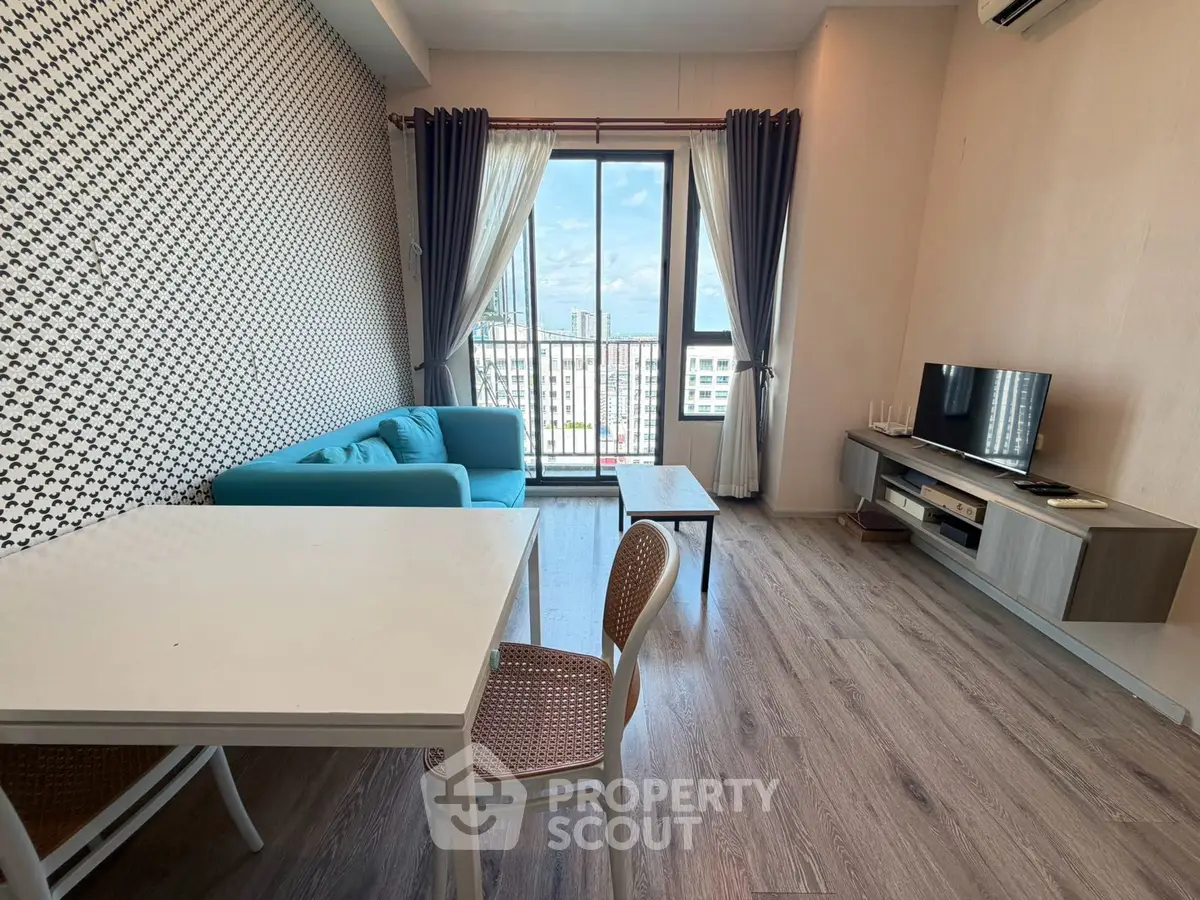 Modern living room with stylish decor and city view balcony