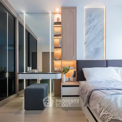 Luxurious modern bedroom with elegant lighting and stylish decor, featuring a cozy bed and sleek vanity area.