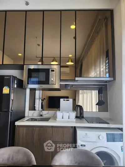 Modern kitchen with sleek appliances and open layout design