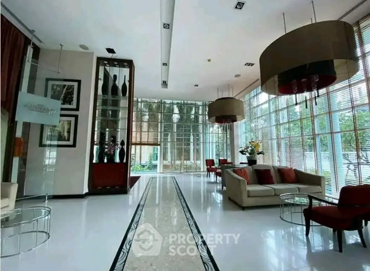 Luxurious modern living room with elegant decor and large windows