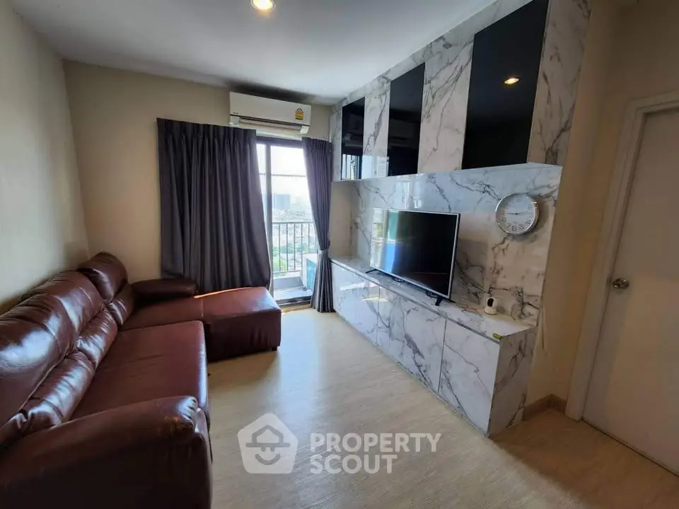Modern living room with marble TV wall and leather sofa, featuring a large window with city view.