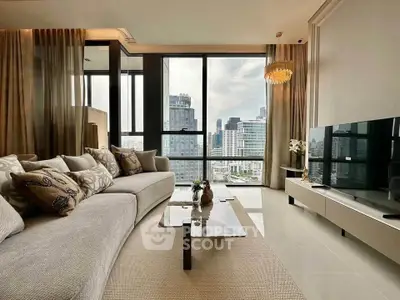 Luxurious living room with stunning city view, elegant decor, and modern furnishings in high-rise apartment.