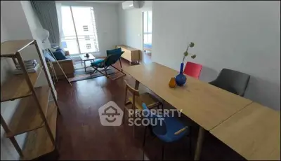 Spacious modern living room with stylish furniture and large windows for natural light.