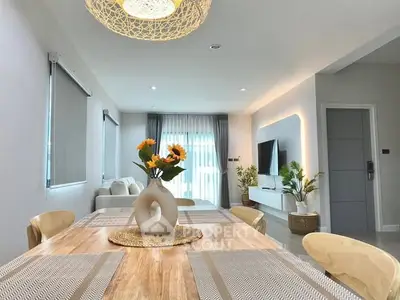 Modern dining area with stylish decor and natural light in a contemporary home.