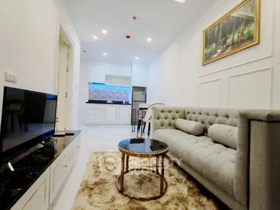 Luxurious living room with plush sofa and modern kitchen in open layout