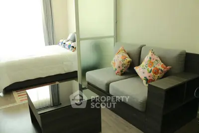 Modern studio apartment with cozy living area and stylish bedroom