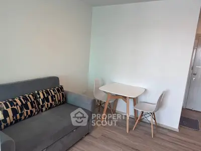 Cozy living room with modern sofa and dining table in stylish apartment