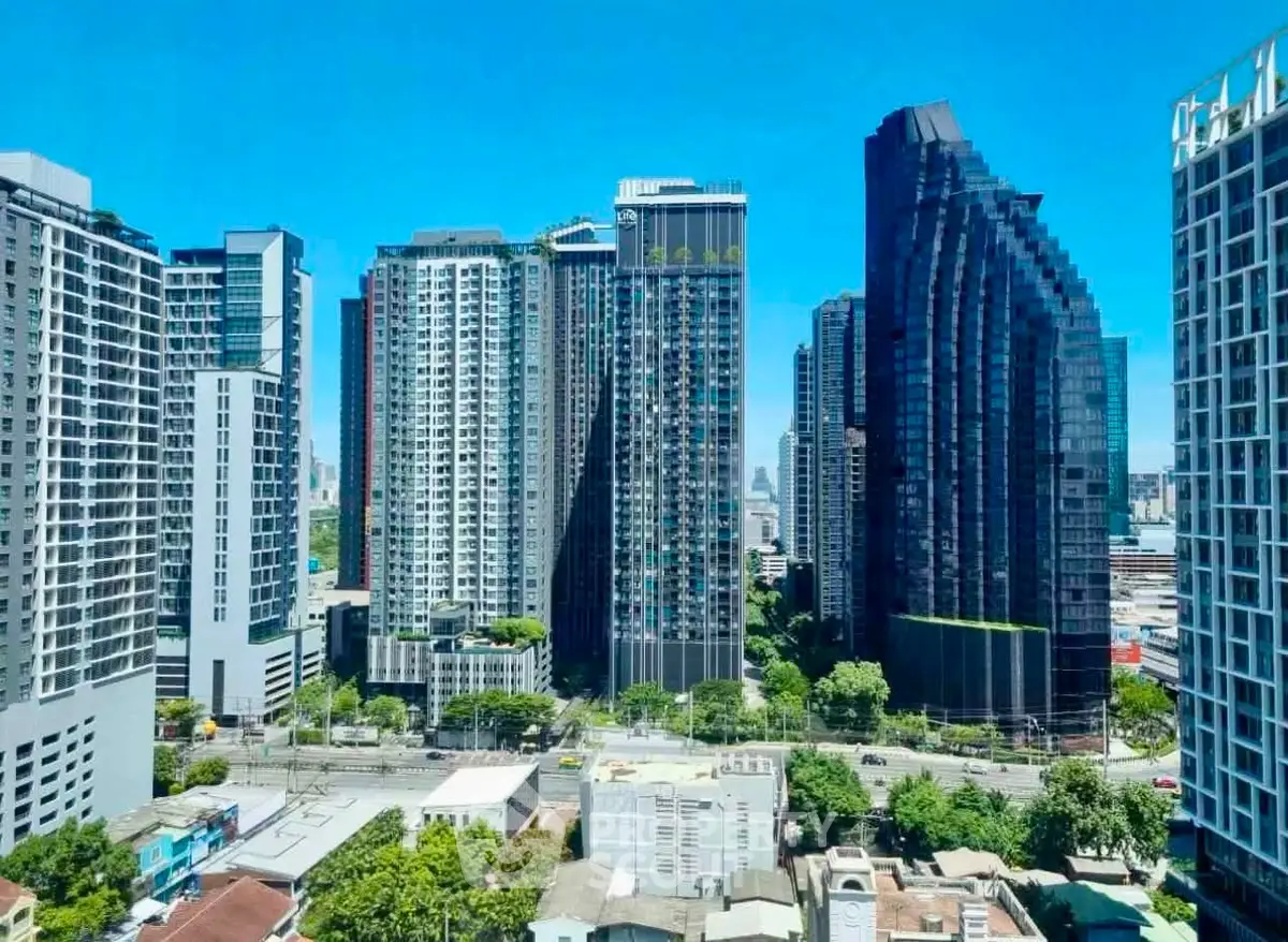 Stunning cityscape view of modern high-rise buildings under a clear blue sky.