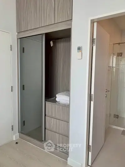 Modern apartment interior with built-in wardrobe and bathroom access