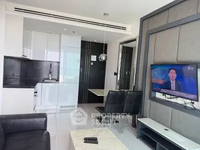 Modern living room with sleek furniture and wall-mounted TV in a stylish apartment.
