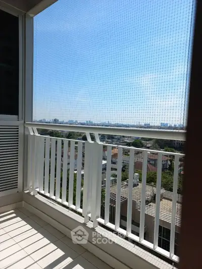 Spacious balcony with city view, perfect for relaxation and enjoying the skyline.