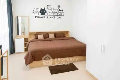 Cozy bedroom with modern decor and charming wall art, perfect for relaxation and comfort.