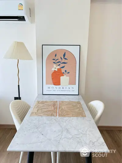 Stylish dining area with marble table and modern decor