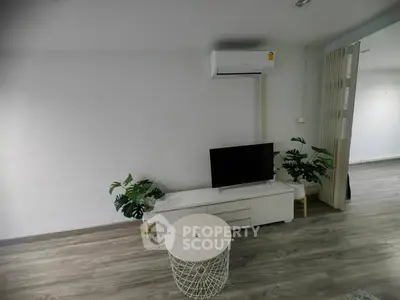 Modern living room with sleek TV setup and stylish decor