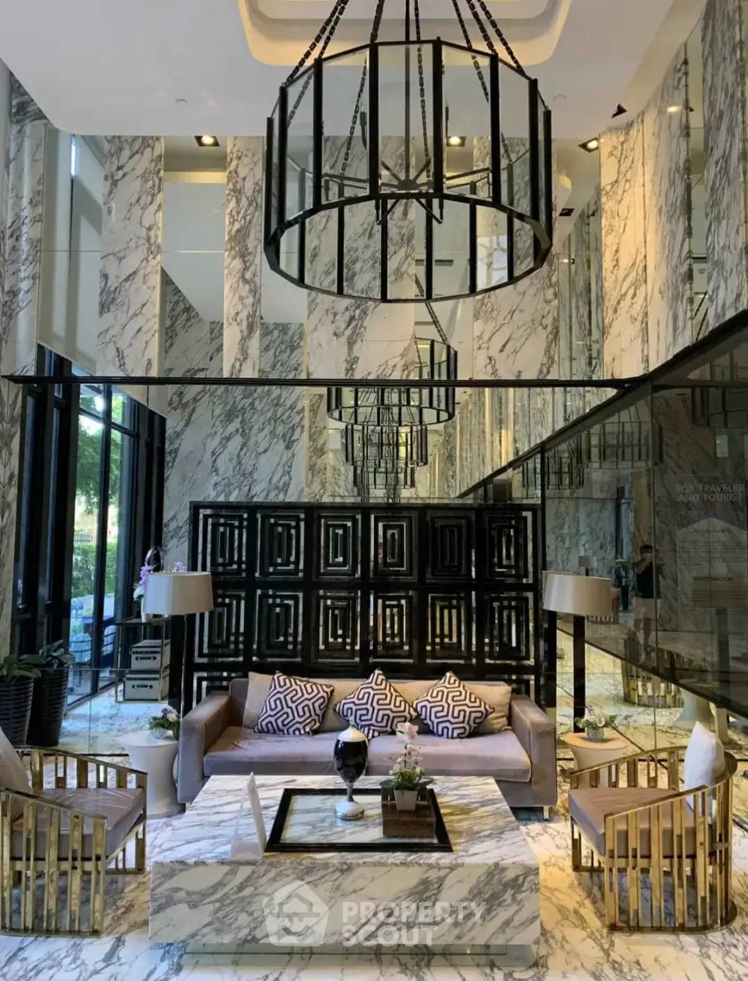 Luxurious modern living room with marble walls and elegant chandelier