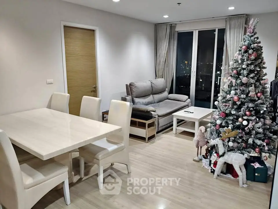 Modern living room with festive Christmas decor and city view