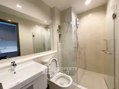 Modern bathroom with glass shower and sleek fixtures