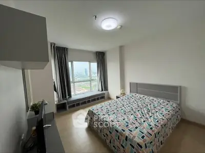 Spacious bedroom with city view and modern decor