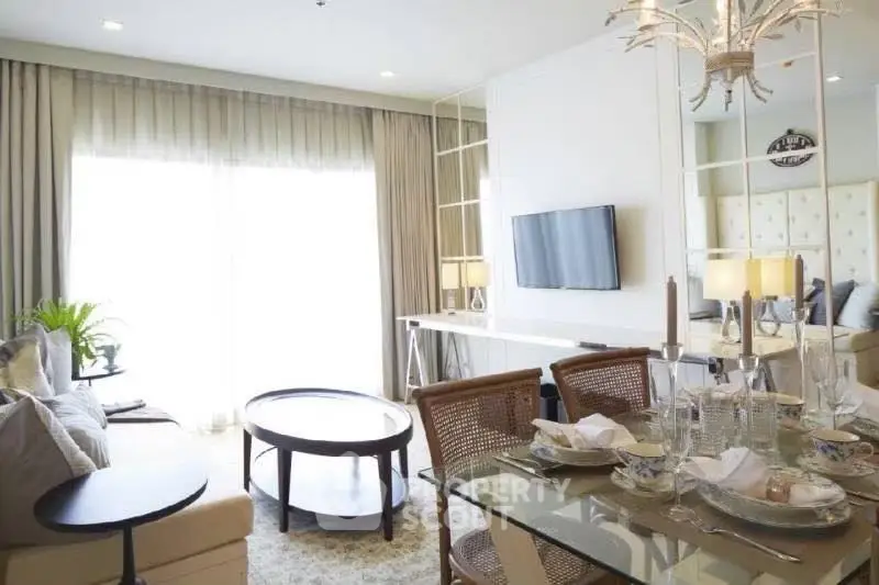 Elegant living room with dining area, modern decor, and natural light in a stylish apartment.