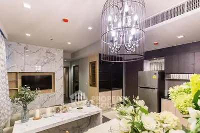 Luxurious modern living room with elegant chandelier and marble accents