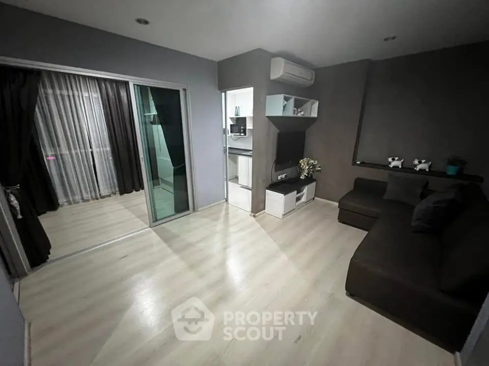 Modern living room with sleek design and balcony access