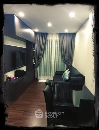 Modern living room with sleek furniture and elegant curtains